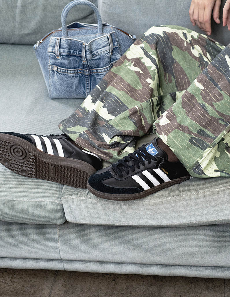 Model wears casual outfit featuring Acne Studios, Givenchy and adidas