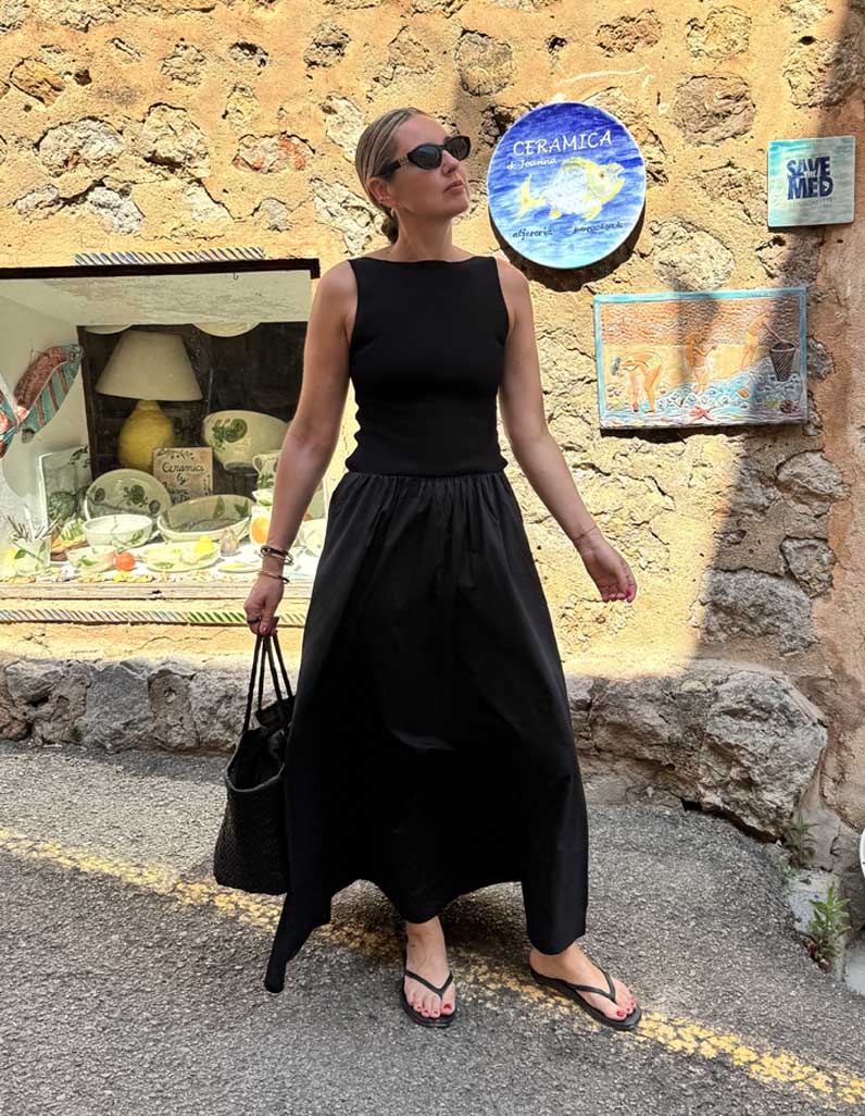 Emma Rose Thatcher wearing black dress