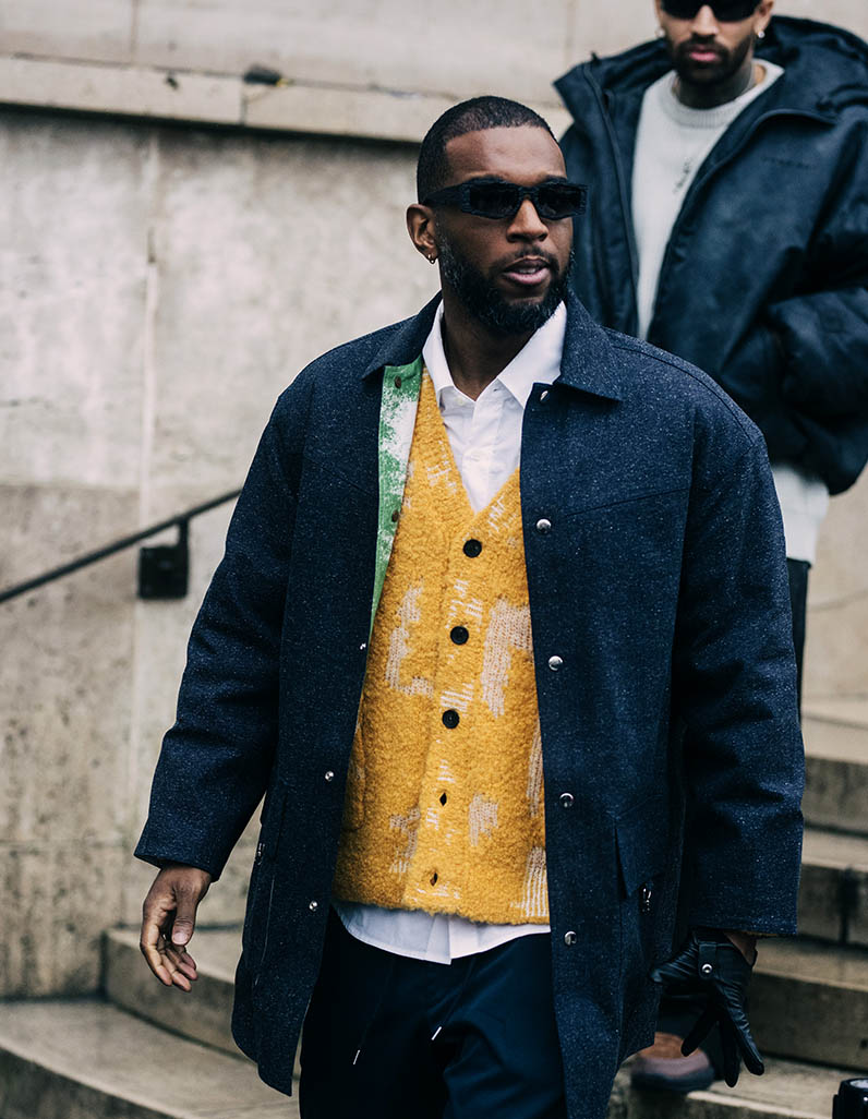 Streetstyle image of a man wearing a shirt and shorts by Prada