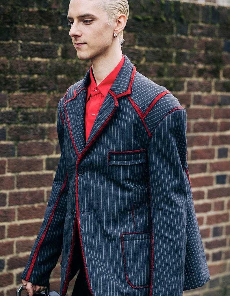 Street style image of a man wearing a blazer