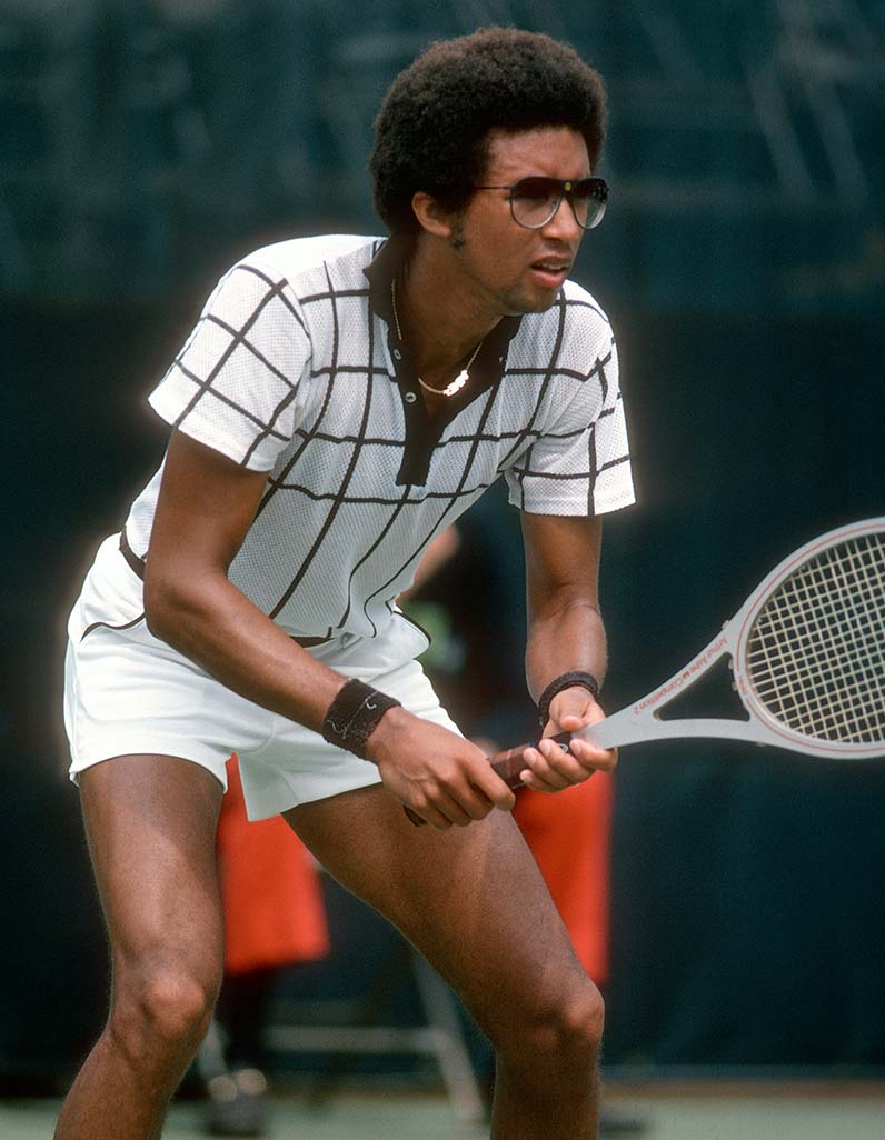 Arthur Ashe tennis player holding a racket