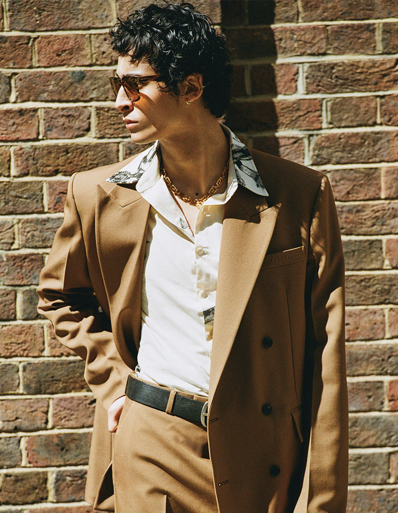 A model wearing A Bathing Ape puffer jacket and Balenciaga Shorts