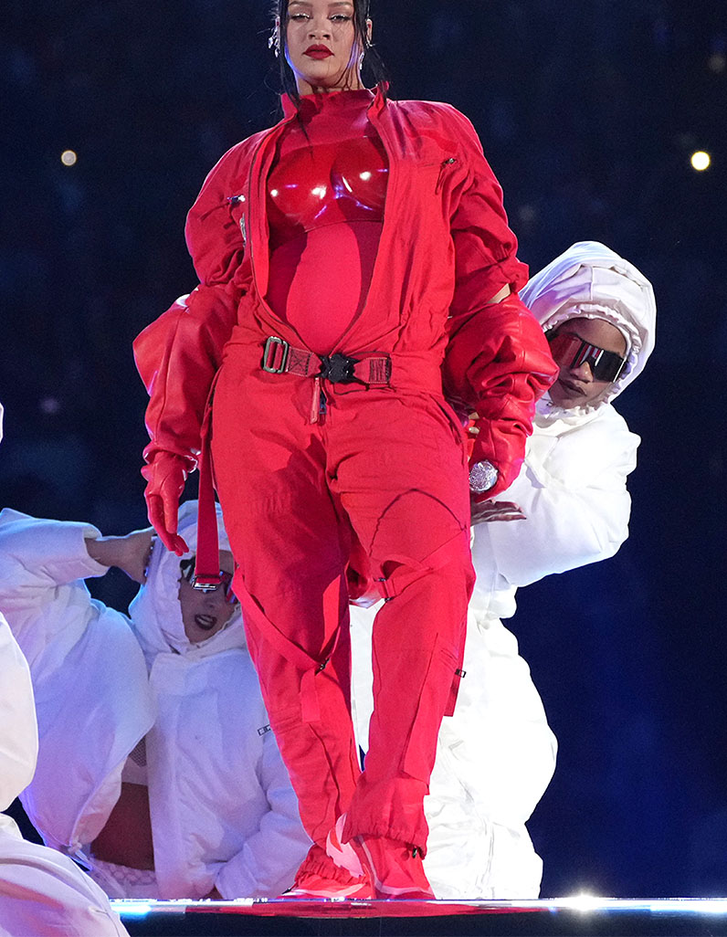 Rihanna at Super Bowl LVII. Dressed in full red ensemble. 
