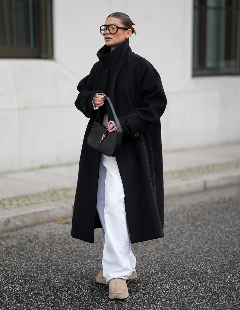 women in white jeans, long oversized coat