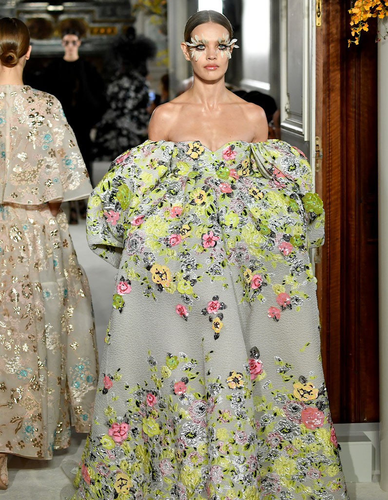 Floral gown in grey and green hues.