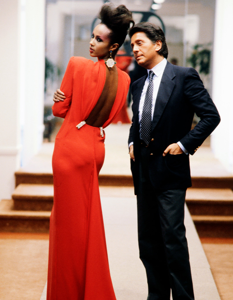 Model Iman with Valentino in red backless gown